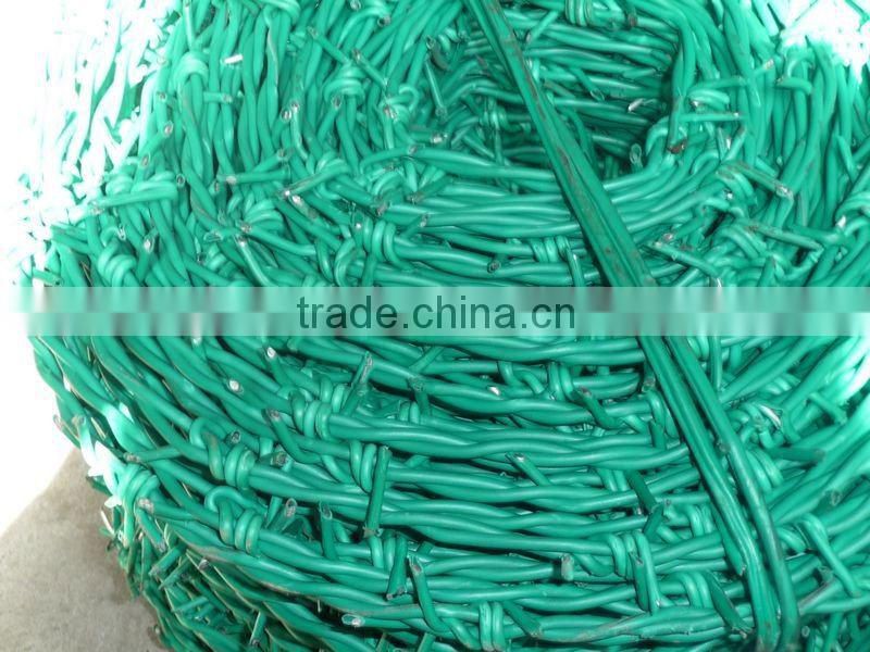 Galvanized barbed wire fence