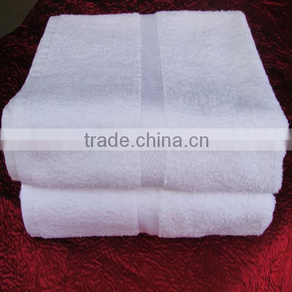 white cotton hotel bath towel