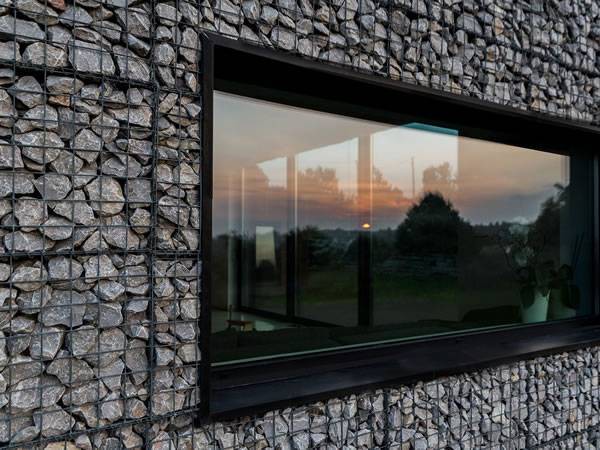 A studio with gabion around window.