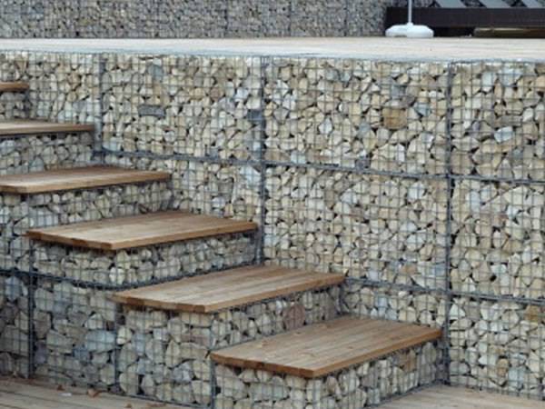 Gabion baskets are filled with rocks as steps and wall.