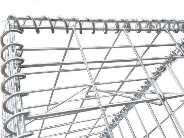 Shining gabion basket with stiffeners is on ground.
